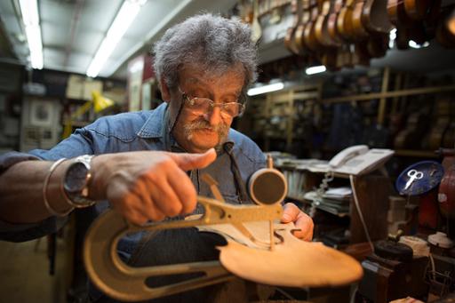 A Daniel Levin photograph of Amnon Weinstein in the luthier's workshop in Tel Aviv, Israel.