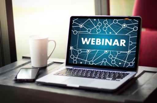 Photo illustration with computer screen showing the word "webinar"