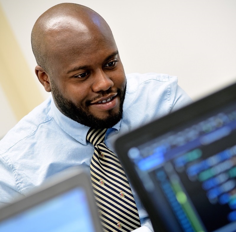 Cleveland Codes boot camp student sitting in front of computer