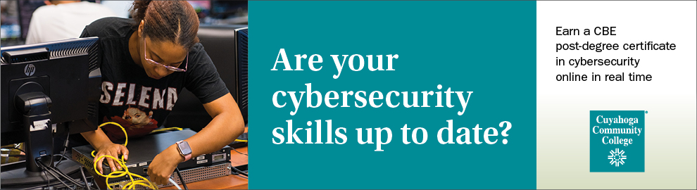 A woman in front of a computer: Cybersecurity skills at your own pace