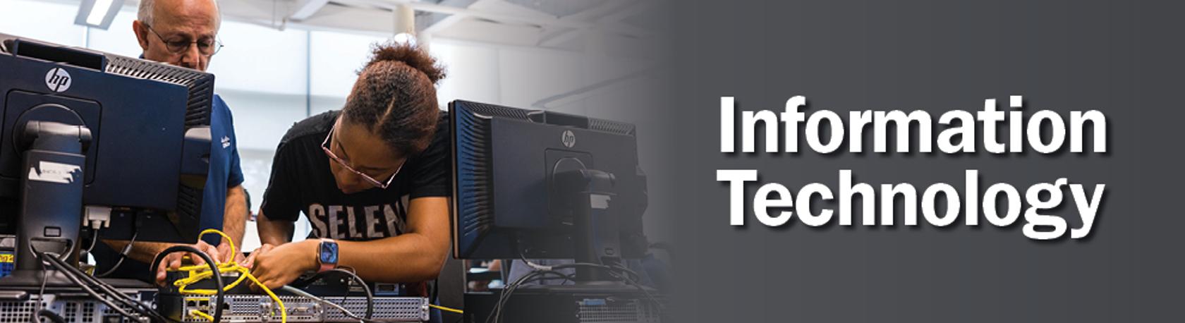 Workforce training banner image with woman adjusting computer hardware and instructor in the background with the words information technology on a gray gradient background.