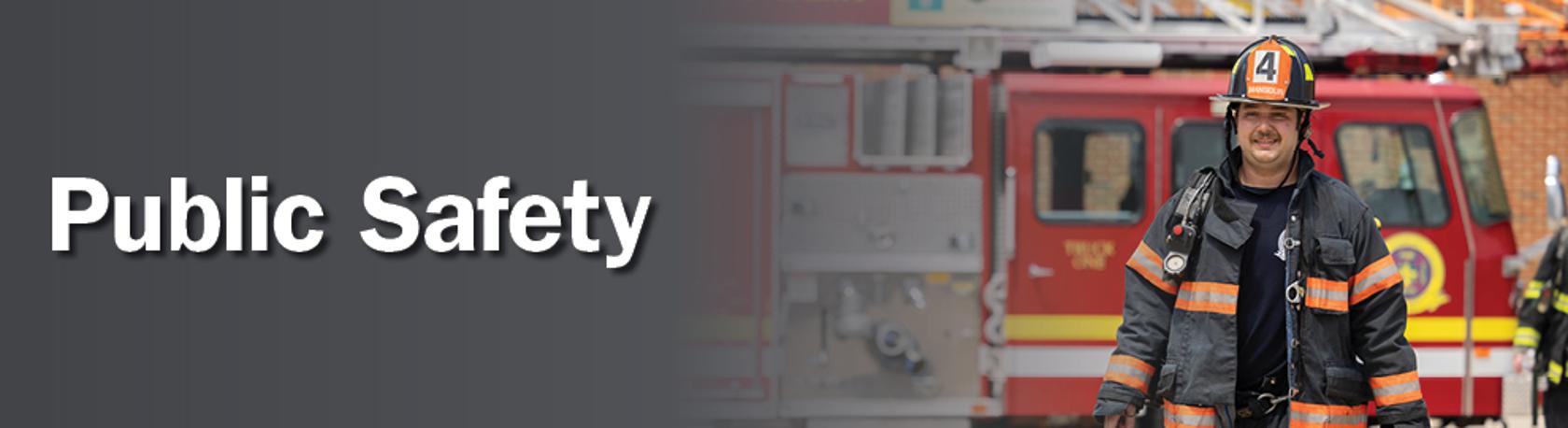 Workforce training banner image with man in firefighter uniform standing in front of a fire truck with the words public safety on a gray gradient background. 
