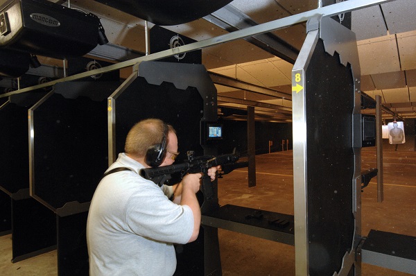 Police officer training at indoor firing range