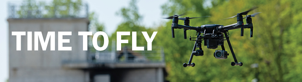 Image of drone with skyline with words Time to Fly